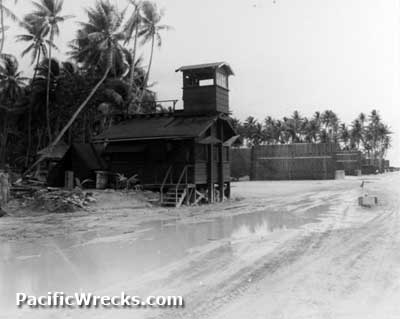 Funafuti Airfield Operations Tower (center) and ravetment line (right)